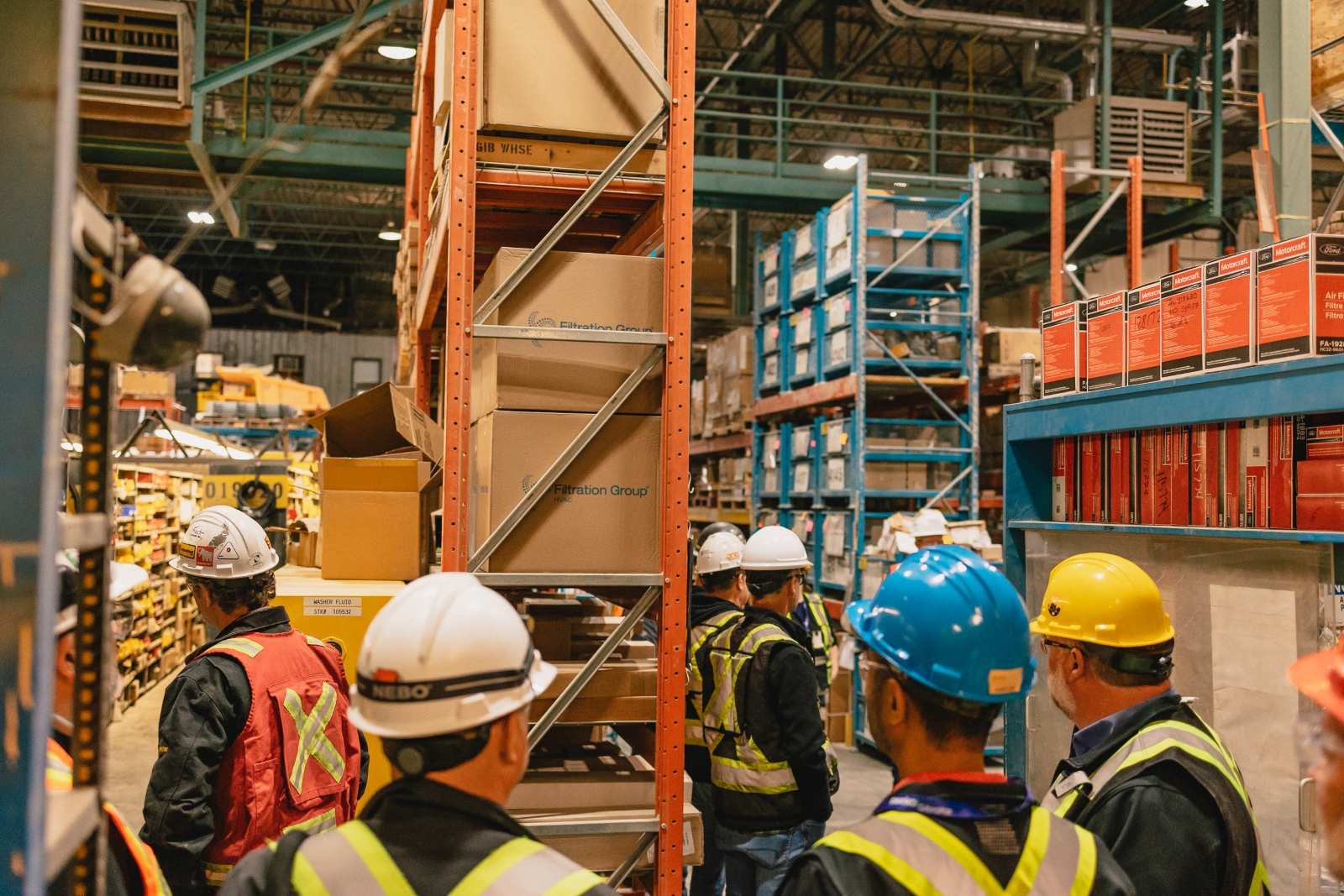 Industry representatives touring a parts warehouse at Gibraltar Mine in British Columbia.